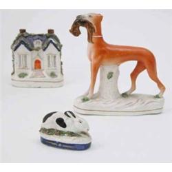 A Victorian-style model of a retriever, with dead prey, 7.5ins high, a similar model of a money b...