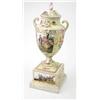 Image 1 : A late 19th century Crown Dresden two-handled vase and cover, on plinth, painted with figure pane...