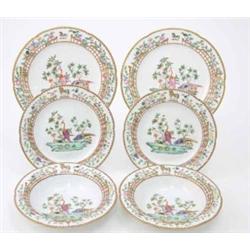 A set of six early 19th century English porcelain plates, painted with wild birds amidst crested...