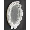 Image 1 : A German porcelain oval mirror frame, elaborately modelled with cherubs, foliage and musical inst...