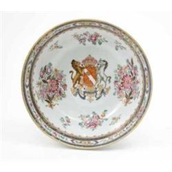 A 19th century Samson armorial fruit bowl, painted with crest and flower sprays in bright enamels...