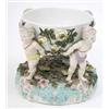 Image 1 : A 19th century Sitzendorf centrepiece, modelled with four nymphs supporting floral-encrusted bowl...