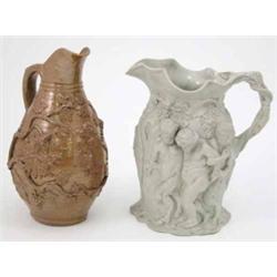 An early Victorian stoneware Bacchus jug, moulded with figures and grape vines in bold relief, 9i...