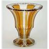 Image 1 : An amber-overlaid glass vase, of flared form, on cut circular base, 8ins...