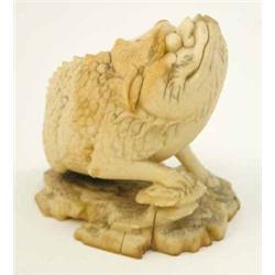 A Meiji marine ivory carving of a toad, perched on a naturalistic base, a hole in his mouth to su...