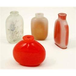 Four Chinese glass scent bottles, one red glass, two tinted and one clear painted with a landscap...