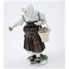 Image 1 : A Meissen figure of an old peasant woman modelled by J.J. Kaendler, standing, wearing a white sha...