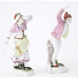 A pair of Frankenthal figures of a peasant boy and girl, he wearing red cap, puce lemon-lined jac...