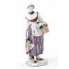 Image 1 : A Ludwigsburg figure of a farmer's wife with a basket and apron of fruit and vegetables and a chi...