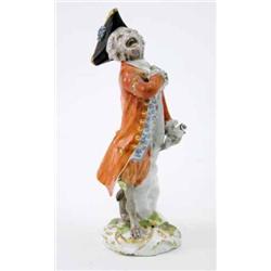 A Meissen figure of a soloist from the monkey band, modelled by J.J. Kaendler holding a sheet of...