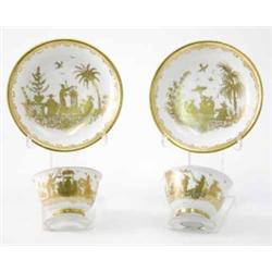 A fine pair of early Meissen gold-Chinese teabowls and saucers finely decorated at Augsburg by Ba...