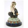 Image 1 : A 19th century majolica comport, (stem only) in the form of a nymph seated upon a swan, on circul...