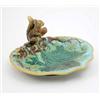 Image 1 : A George Jones majolica nut dish, modelled with a squirrel, leaves and buds against a pale blue g...