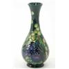 Image 1 : A Moorcroft Finch Teal patterned baluster vase. 6.5in....