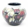 Image 1 : A Moorcroft wisteria vase, circa 1925, with everted rim, decorated with an encircling pattern in...