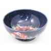 Image 1 : A Walter Moorcroft Anemone bowl, circa 1960, decorated in shades of pink and green against a blue...