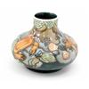 Image 1 : A Moorcroft Rockpool squat vase, late 1990's, decorated in various coloured shades against a blue...