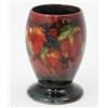 Image 1 : A Moorcroft leaf and berries vase, with waisted foot, circa 1930, decorated in traditional dark m...