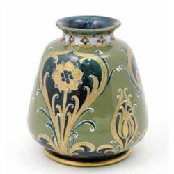 A Moorcroft Macintyre green and gold Florian vase, circa.1903, decorated with tulip buds, flowerh...