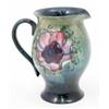 Image 1 : A Walter Moorcroft Anemone jug, circa.1949, decorated in shades of pink and blue against a blue-g...