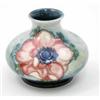 Image 1 : A Walter Moorcroft Anemone squat vase, circa 1953-78, decorated in shades of blue and pink agains...