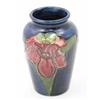 Image 1 : A Moorcroft Orchid posy vase, post war, decorated in shades of pink and green against a blue grou...