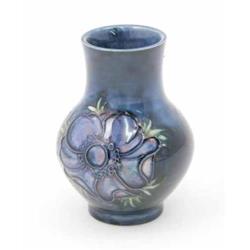 A Moorcroft Anemone posy vase, circa 1953-78, decorated in shades of blue, pink and green against...