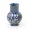 Image 1 : A Moorcroft Anemone posy vase, circa 1953-78, decorated in shades of blue, pink and green against...