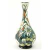 Image 1 : A Moorcroft Lamia vase, circa 2001, decorated in shades of green, brown and white against a cream...