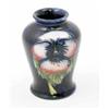 Image 1 : A Moorcroft pansy posy vase, circa 1935, decorated in shades of blue, pink, green and yellow agai...