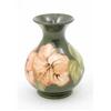 Image 1 : A Moorcroft coral Hibiscus vase, circa 1968-78, decorated in shades of green and coral against a...