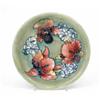 Image 1 : A Walter Moorcroft Orchid shallow bowl, c.1955, decorated in shades of blue, green, red and yello...