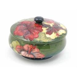 A Moorcroft Hibiscus bowl and cover, circa 1953-78, decorated in shades of green, red and yellow...