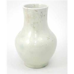 A Moorcroft baluster vase, circa 1928-1949, simply decorated with a simple white glaze, with trac...