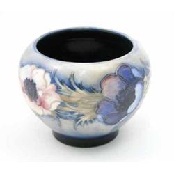 A Moorcroft Anemone vase, circa 1940, decorated in shades of blue, pink and green against a paled...