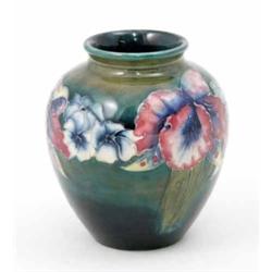 A Moorcroft Orchid small baluster vase, circa 1928-49, decorated in shades of blue, green, pink a...