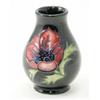 Image 1 : A Moorcroft anemone posy vase, circa 1999, decorated in shades of blue, pink and green against a...