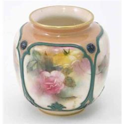 A Hadley's Worcester vase, painted with ogee panels of pink and yellow roses against a peach grou...