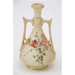 A Royal Worcester two-handled vase, painted with pink and yellow roses against a blush ivory grou...