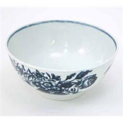 An 18th century Worcester bowl, printed with foliage and butterflies in underglaze blue, hatched...