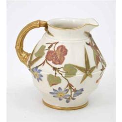 A Royal Worcester jug, moulded and painted with bamboo leaves, gilt handle, date code 1887, shape...