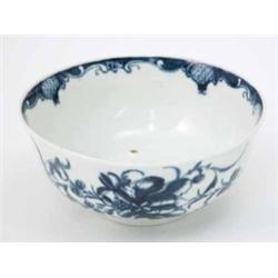 A first period Worcester bowl, continuously painted with flowers in underglaze blue, open crescen...