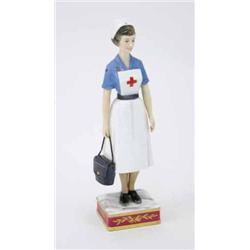 A Royal Worcester figure, British Red Cross Society V.A.D. Member, a limited edition, standing in...