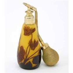 A cameo glass vaporiser, carved brown leaves and signature, Panadis, against a bright yellow grou...