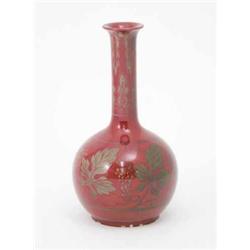 A Bernard Moore vase, monogrammed CHJ, globe and shaft form decorated with fruiting vines against...