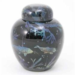 A Bernard Moore ginger jar and cover, painted with swimming fishes and underwater vegetation in l...