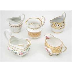 Five various porcelain milk jugs, Derby, Spode and Minton in early 19th century bone china, two i...