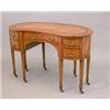 Image 1 : An Edwardian satinwood and kingwood crossbanded kidney shape writing table with tan skiver over o...