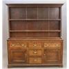 Image 1 : A George III oak dresser with panelled double shelf back over five drawers and two doors on brack...