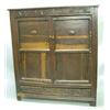 Image 1 : A mid 17th Century oak cupboard with foliate scroll carved frieze and two panelled doors inlaid w...